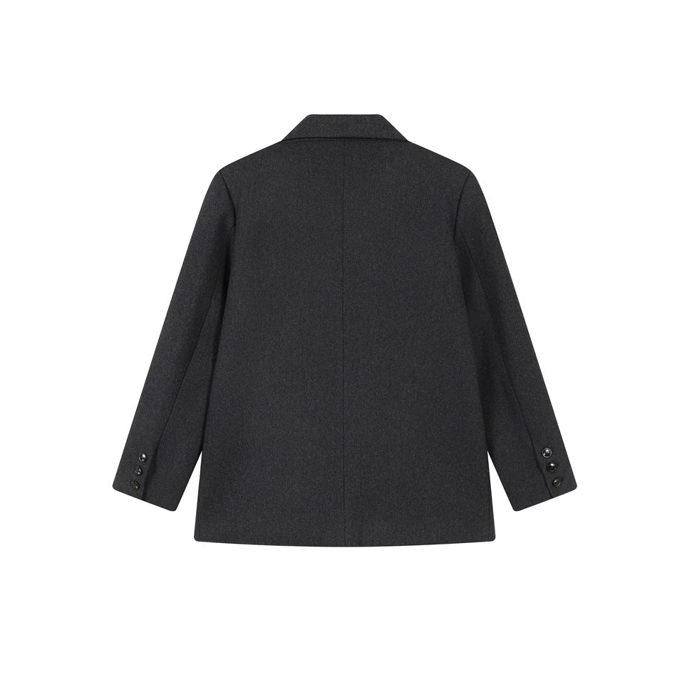 Back view of dark gray blazer jacket with center back seam and three buttons on each sleeve cuff
