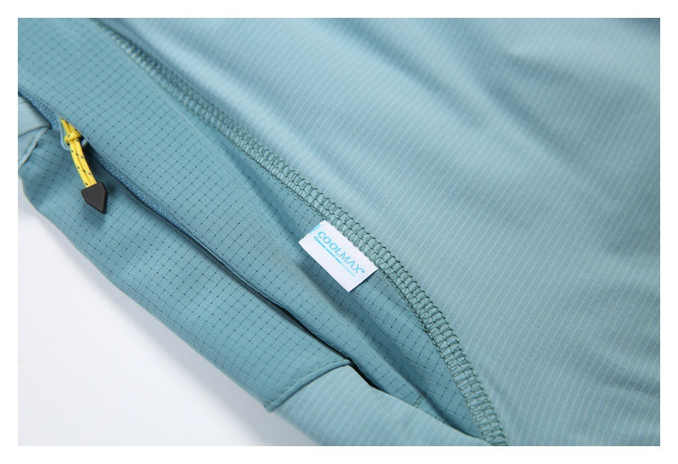 Close-up of a blue-green zippered pocket with a yellow pull and COOLMAX label.