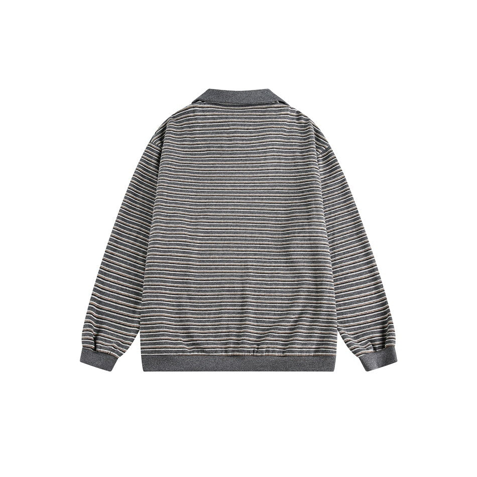 Back of a gray long-sleeve pullover with narrow dark, cream, and tan stripes and solid gray trim.