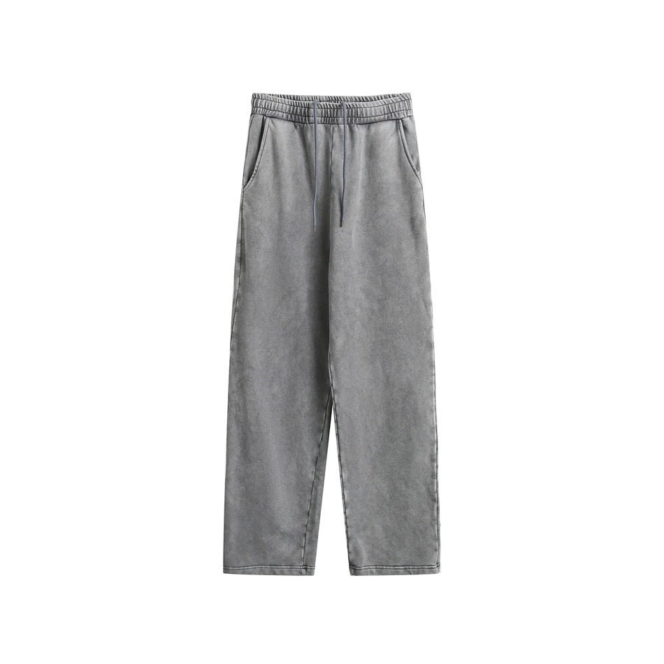 Gray washed sweatpants flat lay with elastic drawstring waist, side pockets and straight legs