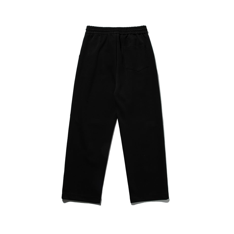 Black sweatpants back view with elastic waistband and a single patch pocket, flat lay