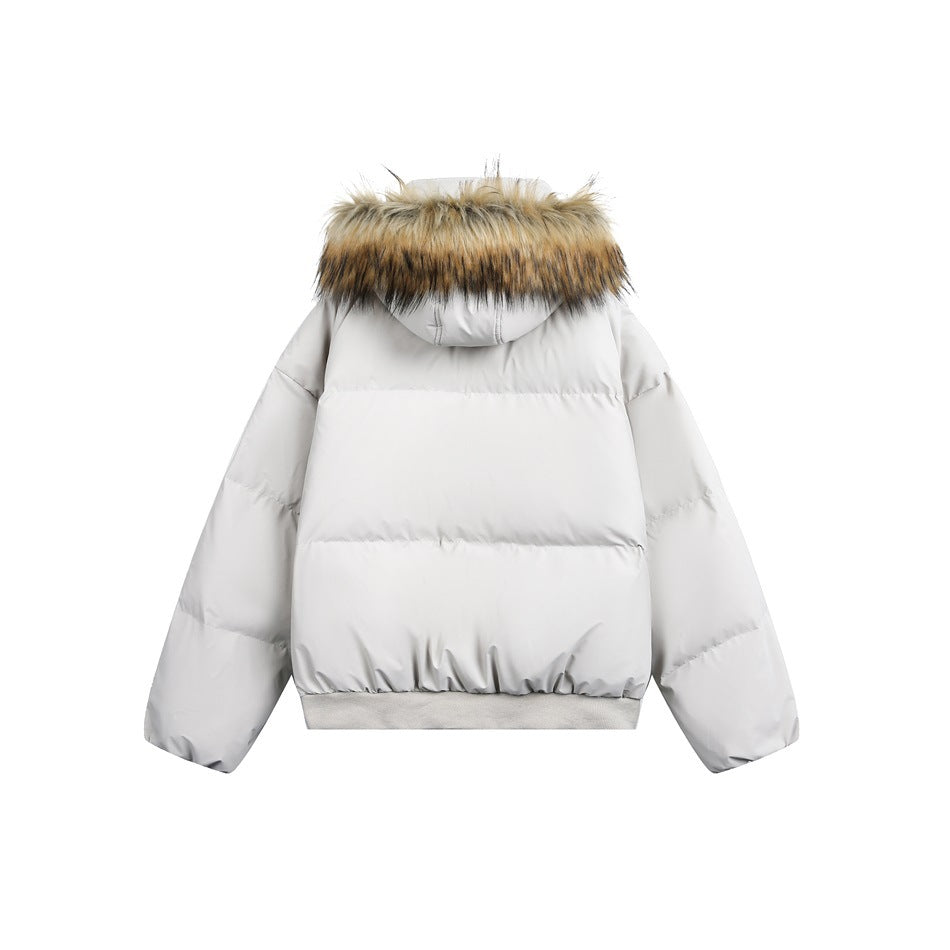 Back view of a light gray puffer jacket with a hood trimmed in tan and black faux fur and a ribbed hem.