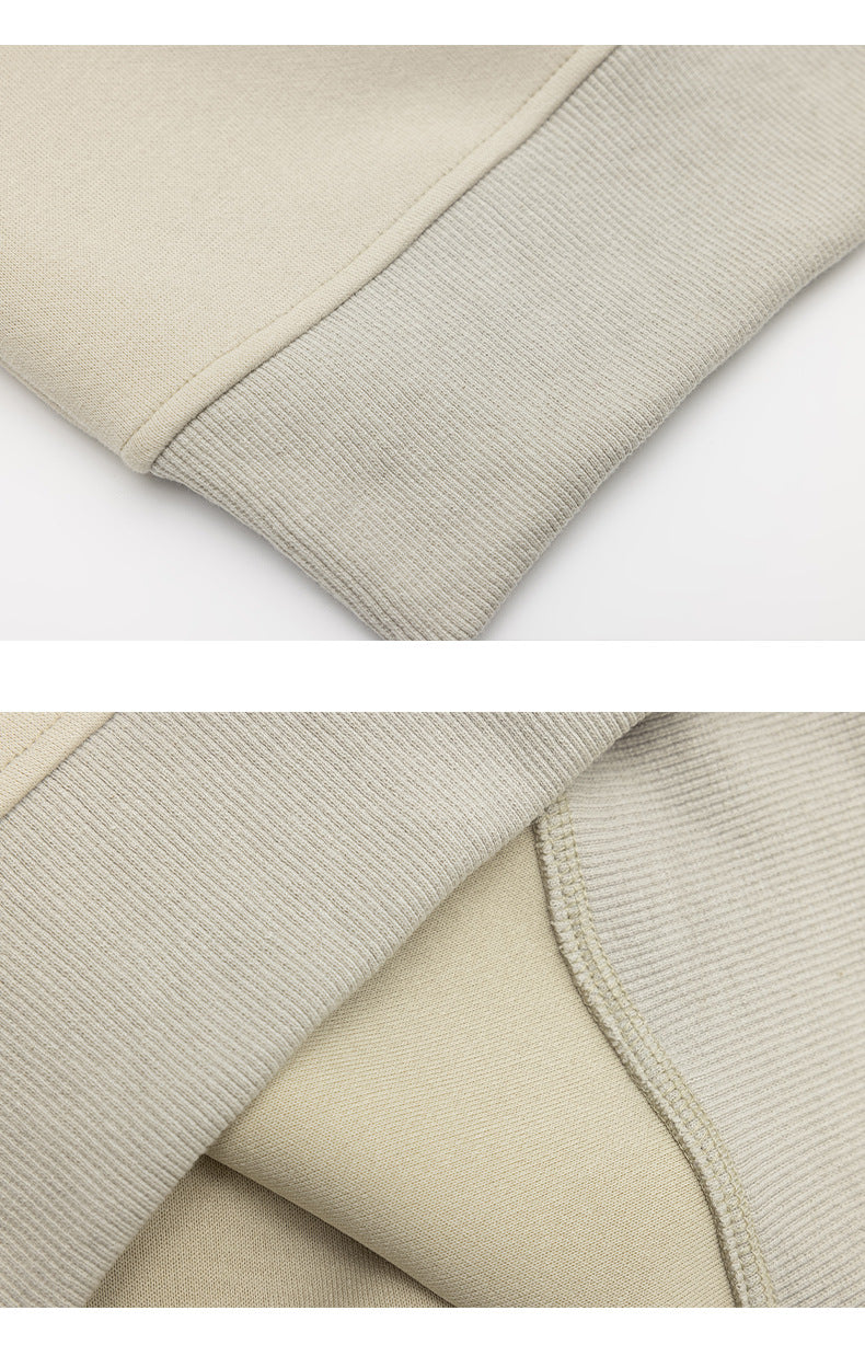 Close-up views of a cream sweatshirt showing a ribbed cuff and hem, fabric, and interior seam stitching.
