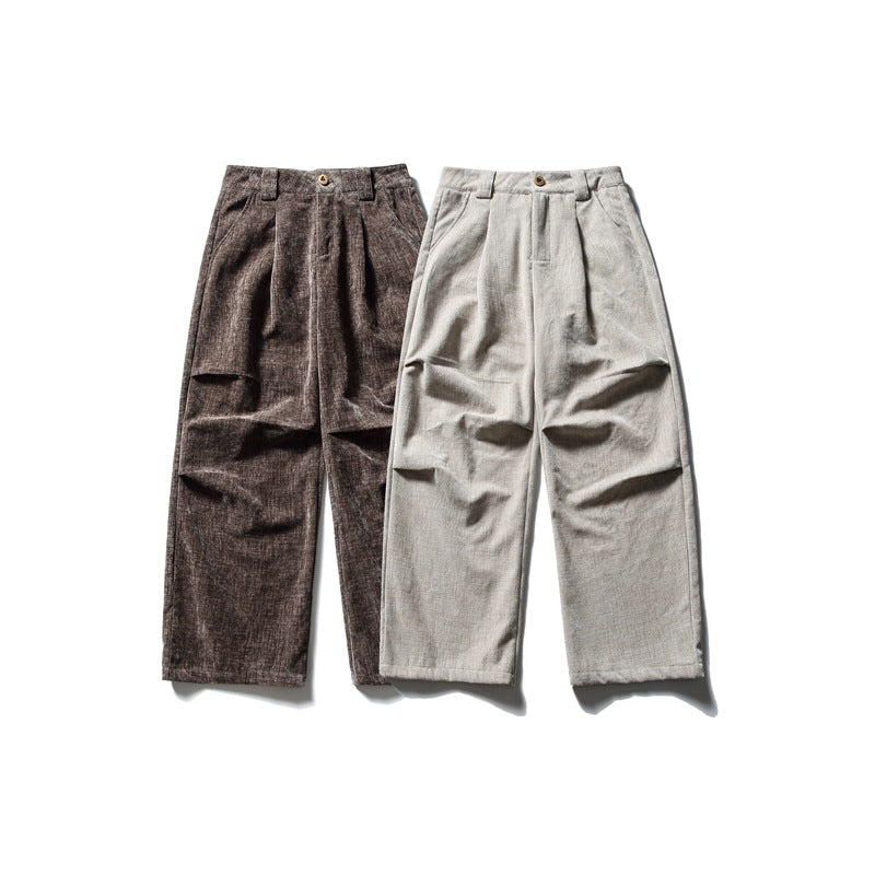 Two pairs of pleated wide-leg trousers shown from the front in brown and light beige.