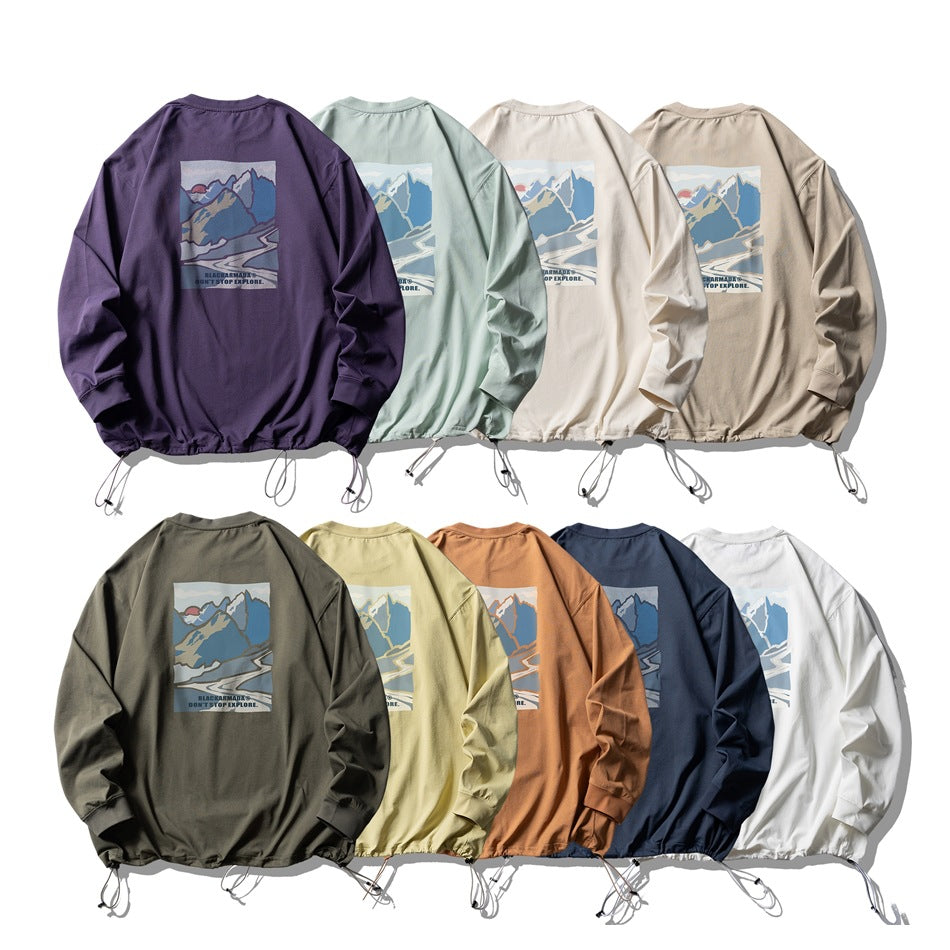 Nine long-sleeve shirts shown from the back in assorted colors, each with a mountain graphic.