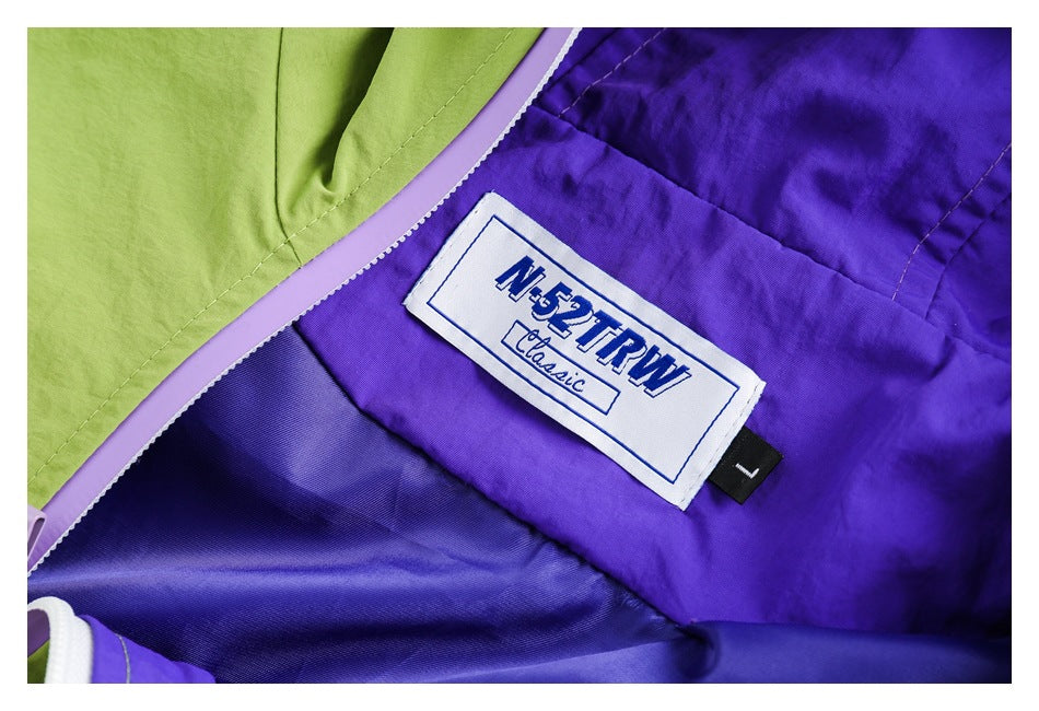 Close-up of the jacket's purple interior lining and sewn-in fabric label.
