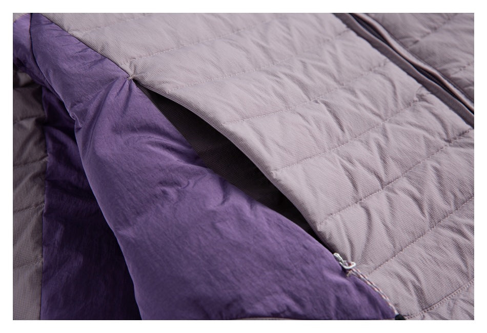 Close-up of the jacket's mauve-gray quilted outer shell and deep purple lining.