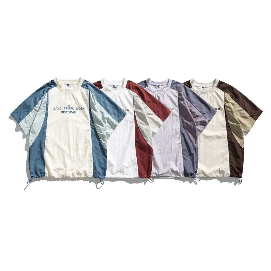 Four short-sleeve color-block shirts shown from the front in blue, red, lavender, and brown combinations.
