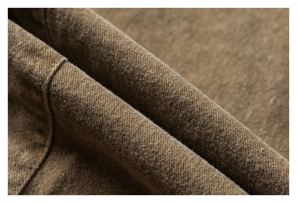 Close-up showing the brown jacket fabric's textured weave and folded seam.