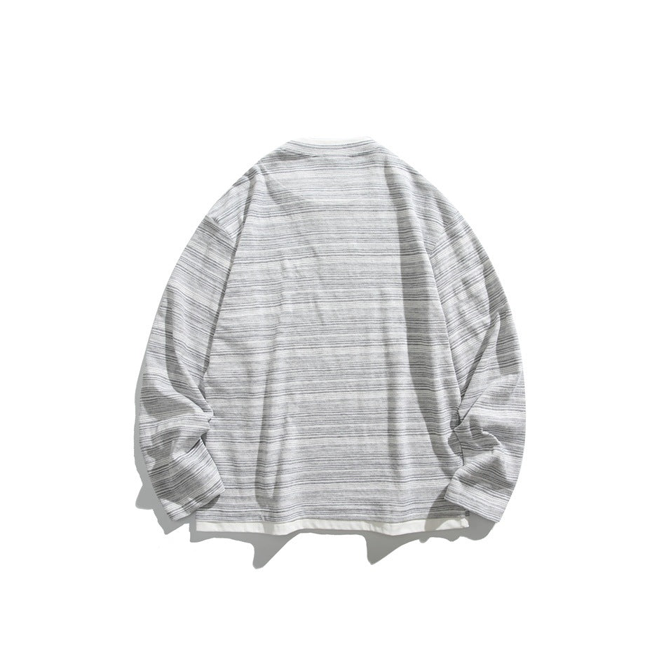 Back view of a gray-and-white striped long-sleeve shirt laid flat.