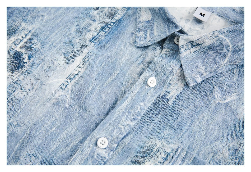 Close-up of a light blue distressed denim shirt collar, white buttons, and an M size label.