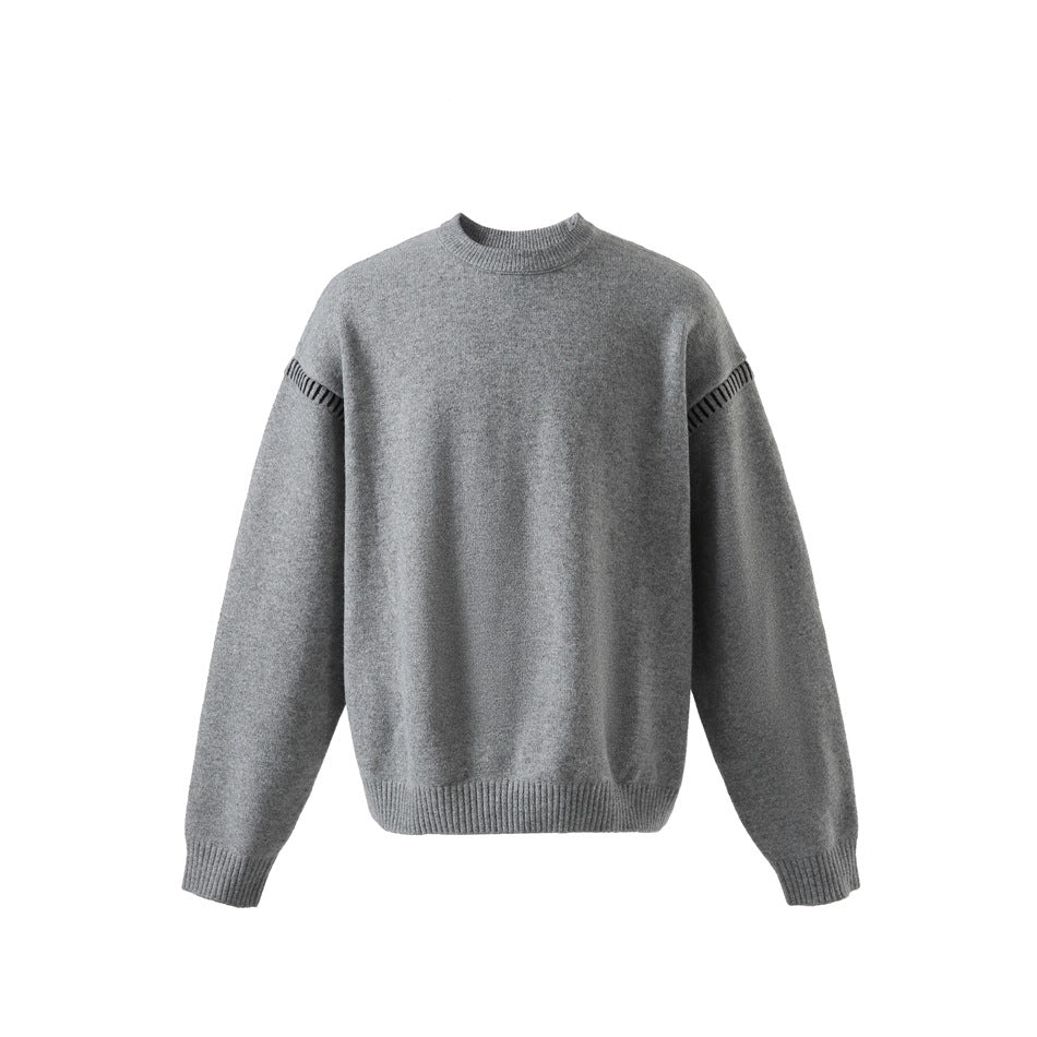 Gray crew-neck knit sweater, front view, with dark contrast stitching along the shoulder seams