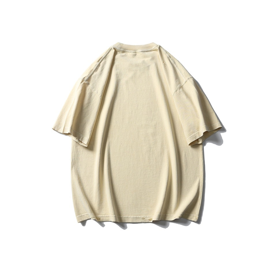 Back view of an oversized cream T-shirt with short sleeves and a plain design.