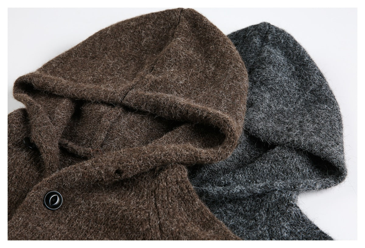 Close-up of brown and charcoal hooded cardigans, showing the hoods, textured knit, and a black button.