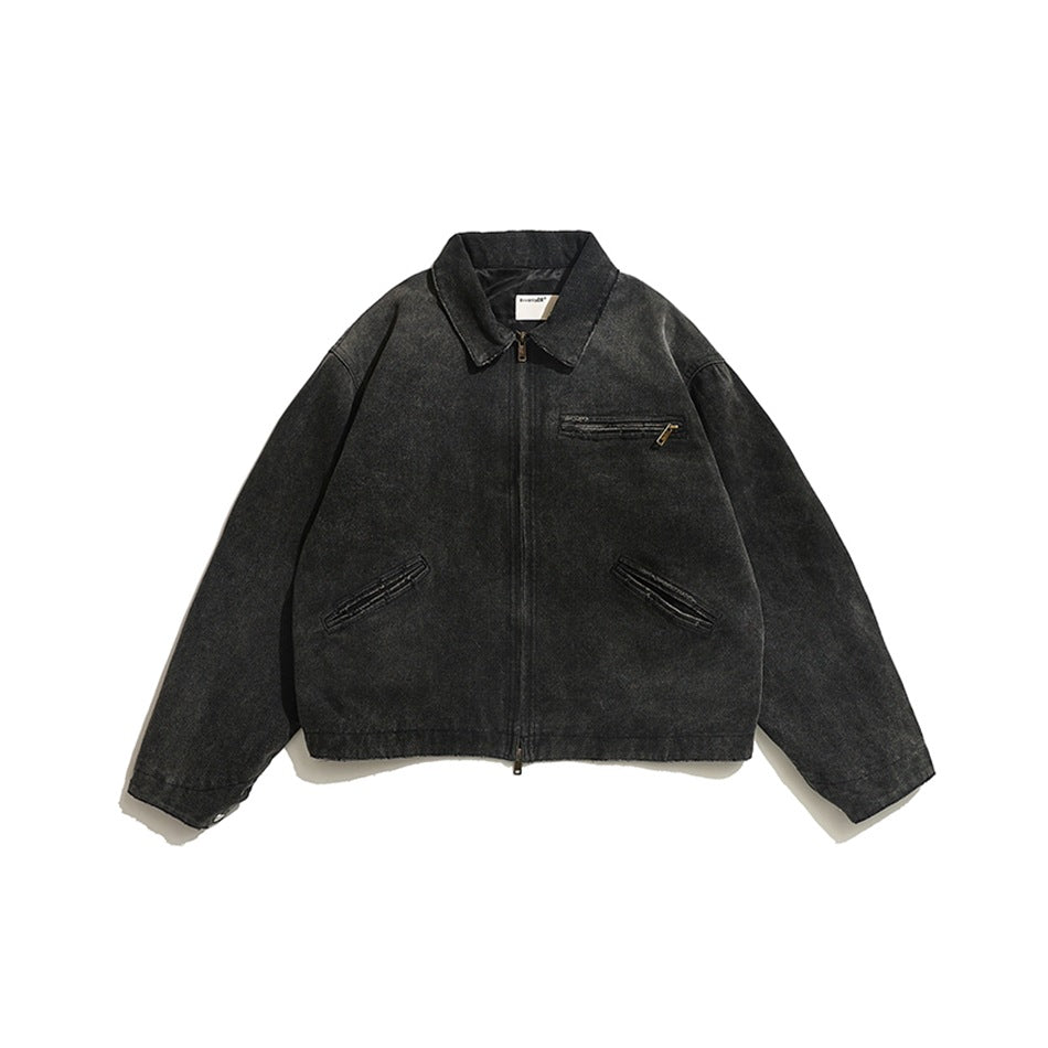 Faded black washed zip-front jacket with pointed collar, chest zip pocket and slanted front pockets, flat lay