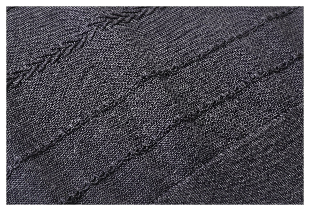 Charcoal knit surface with diagonal raised stitching and a clearly visible fine knit texture.