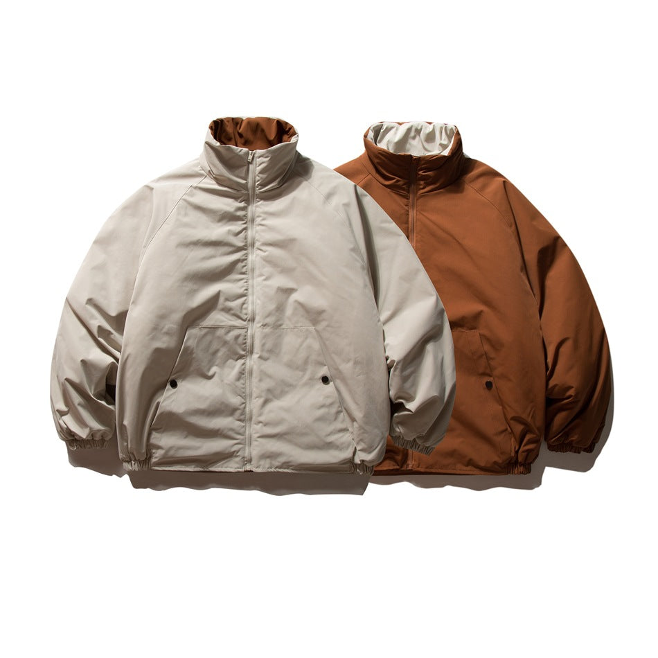 Two front-facing jackets: one light beige and one rust brown, both with high collars and zip fronts.