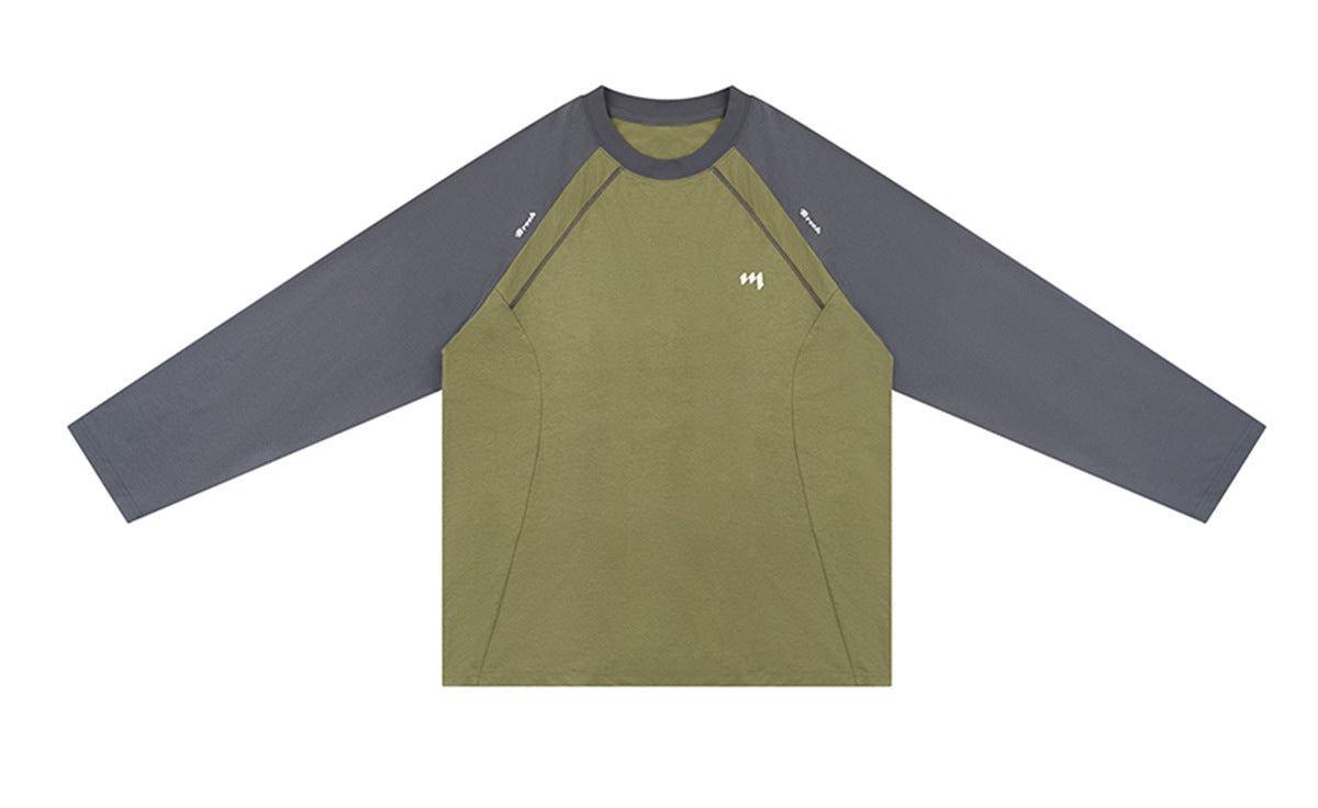 Front of an olive raglan long-sleeve shirt with charcoal sleeves, contrast seams, and a small white chest mark.