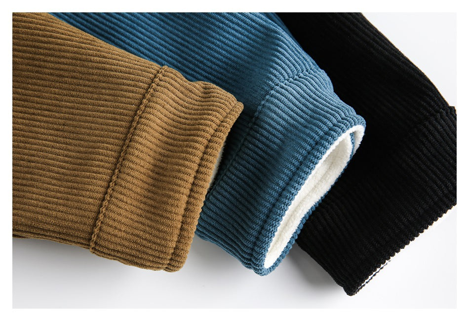 Close-up of ribbed jacket cuffs in camel brown, blue, and black, with white lining visible inside the blue cuff.