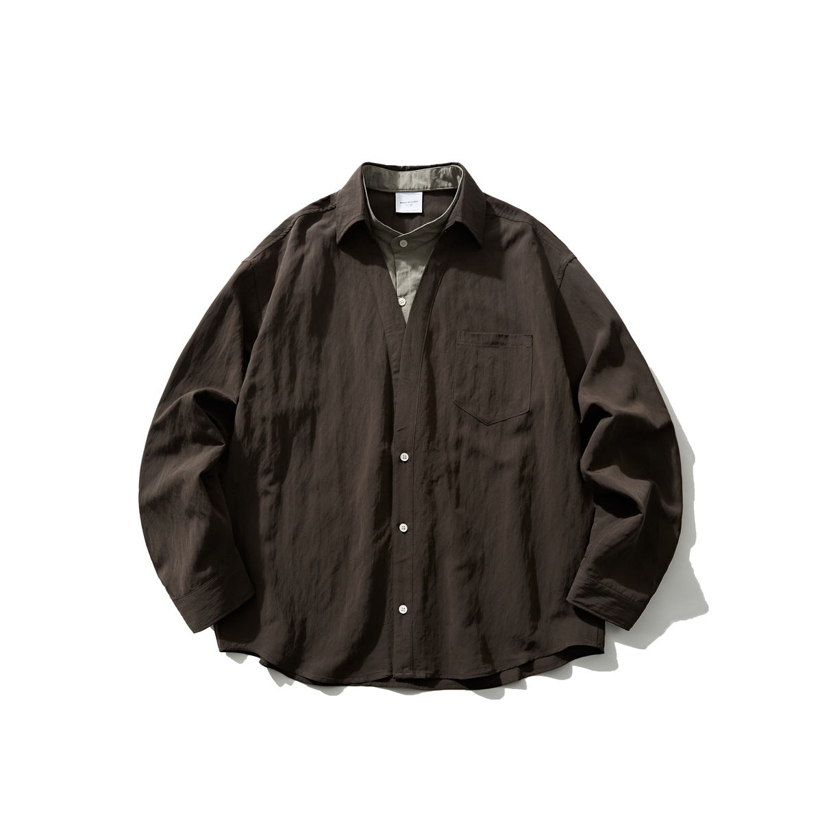 Dark brown long-sleeve button shirt with sage green layered placket and collar insert, flat lay front view