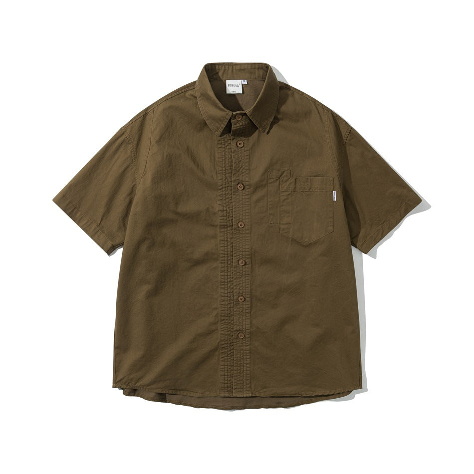 Brown short-sleeve button-up shirt with a pointed collar, stitched front placket and a chest pocket, laid flat