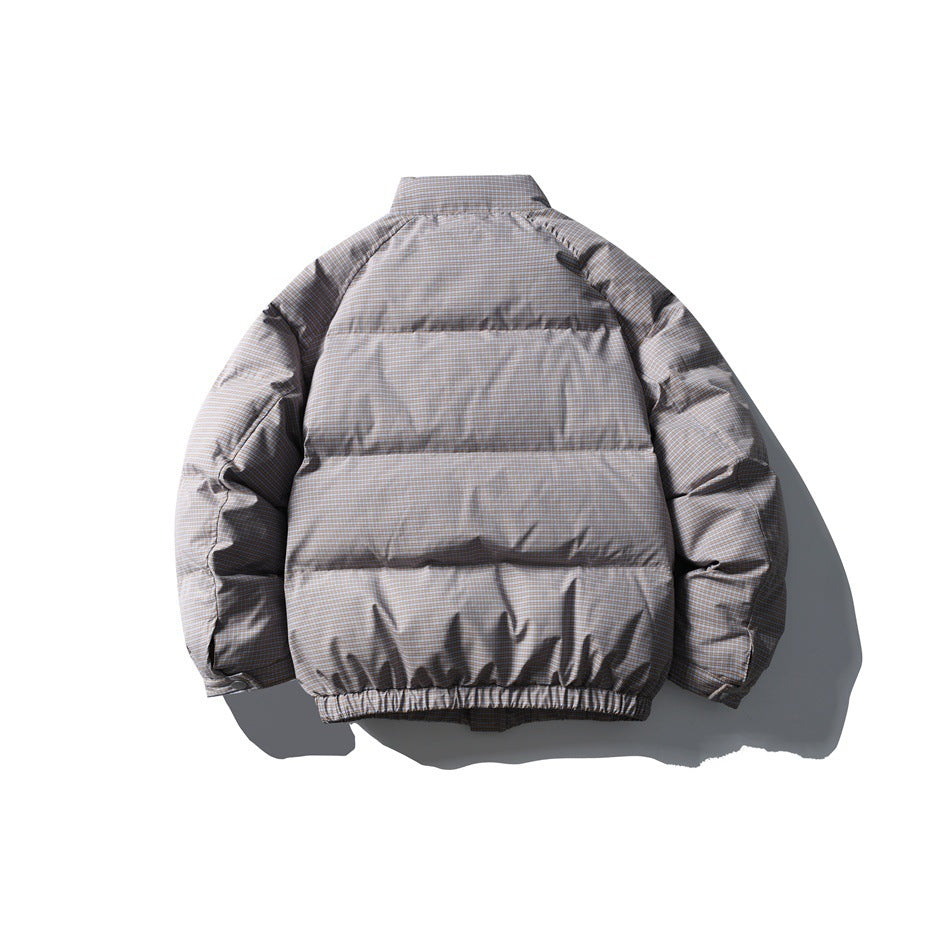 Back view of taupe-gray plaid puffer jacket with horizontal quilted channels and elastic hem