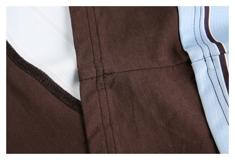 Close-up of brown garment seams, white lining, and a light blue striped fabric edge.