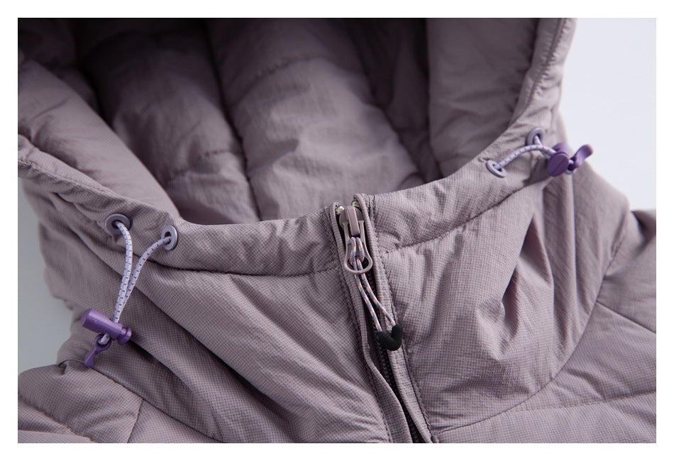 Close-up of a mauve-gray jacket hood showing the front zipper and adjustable purple drawcords.