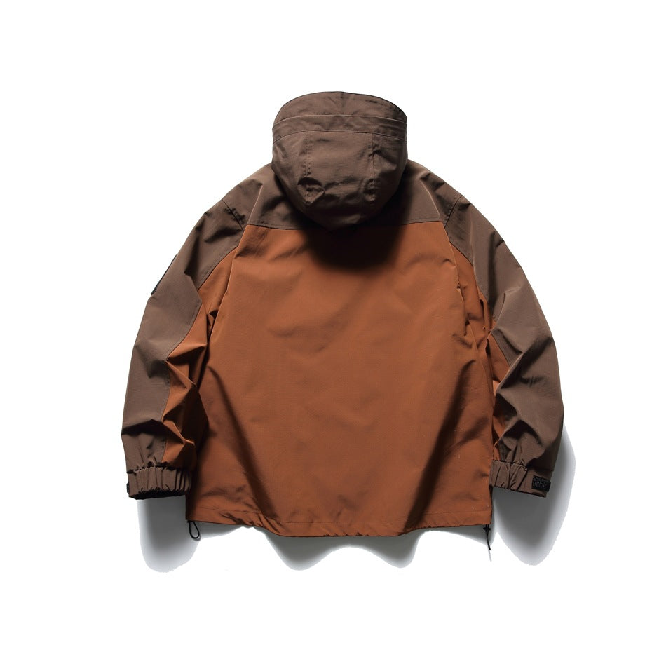 Back view of reddish brown and rust color-block hooded jacket with elasticated cuffs and hem drawcord