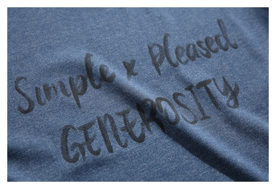 Close-up of dark English lettering printed on the heathered blue T-shirt.