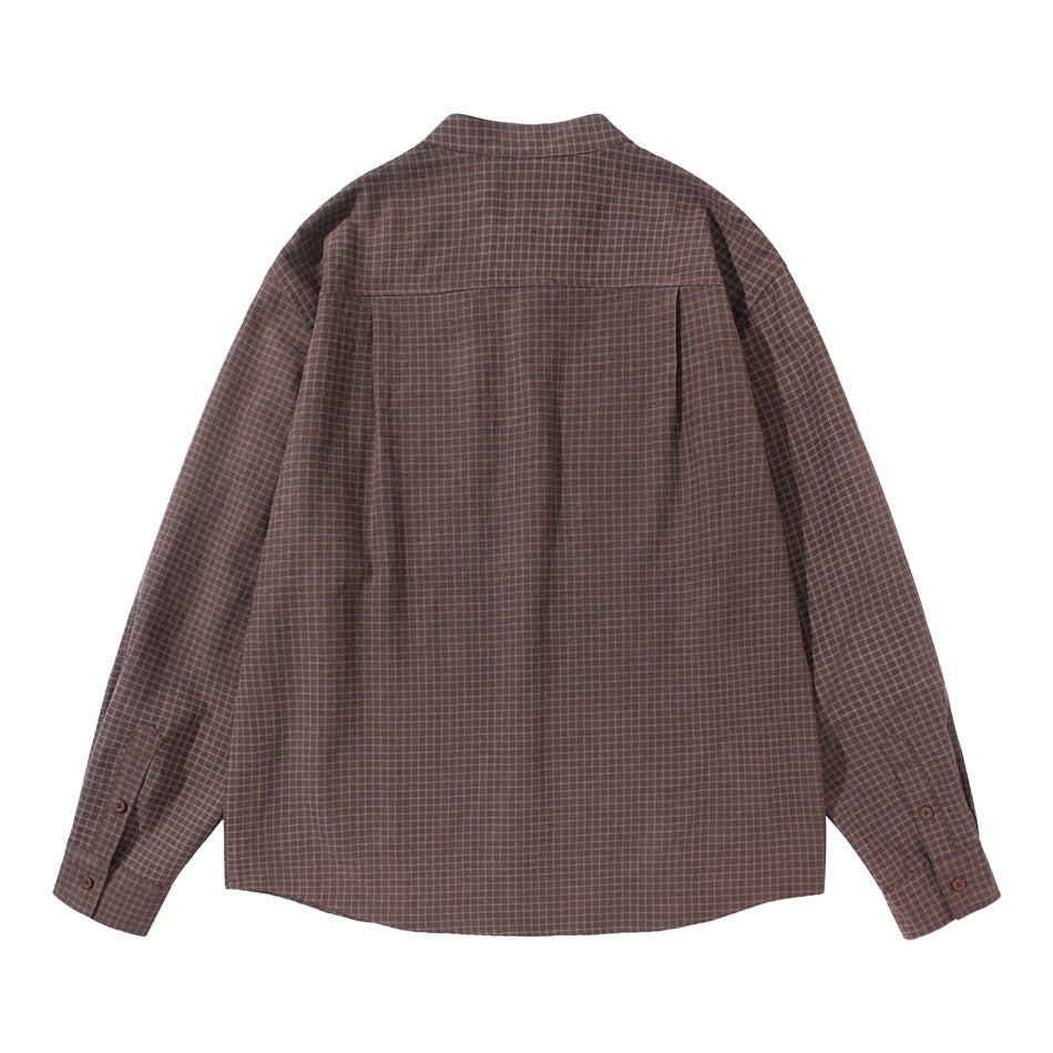 Back view of a dark brown checked shirt with a shoulder yoke and buttoned cuffs.