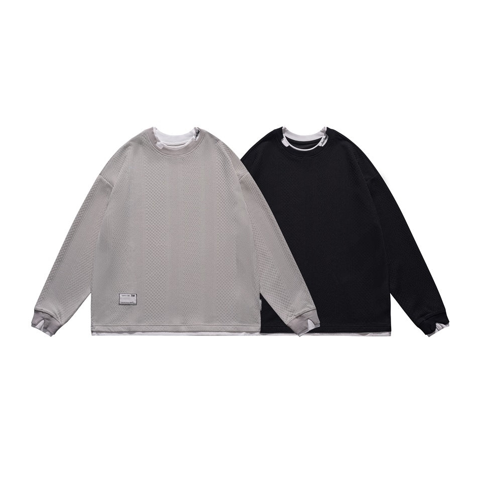 Two long-sleeve textured crewneck tops shown flat: light gray and black, each layered over white.