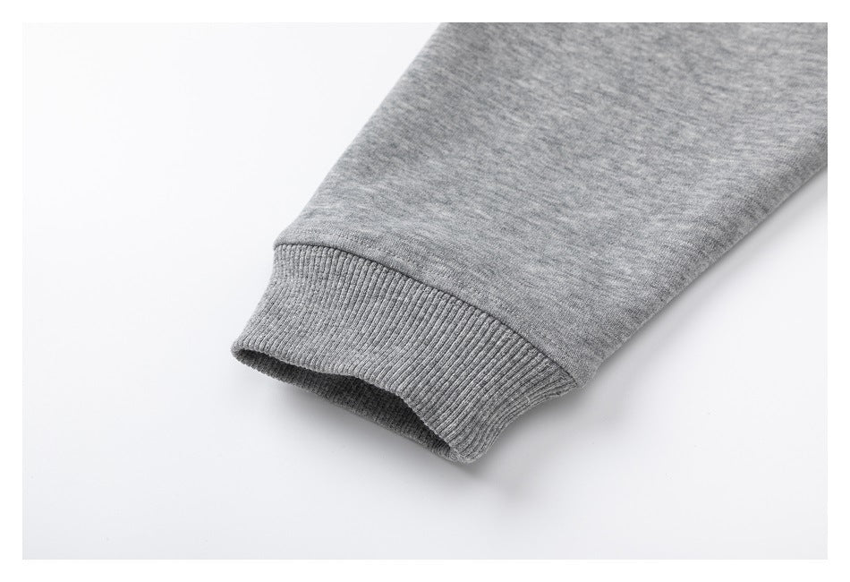 Close-up of a ribbed cuff on a heather-gray sweatshirt sleeve.