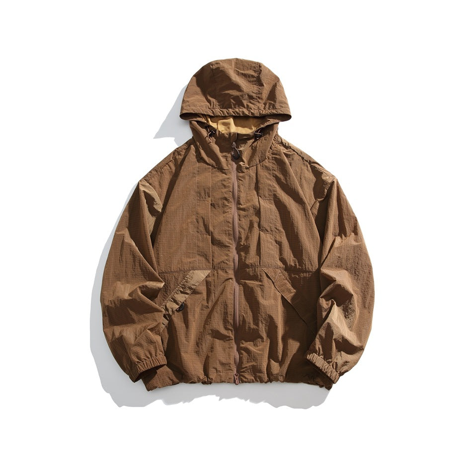 Yellow-brown hooded zip jacket with crinkled ripstop-style texture, flat lay front view