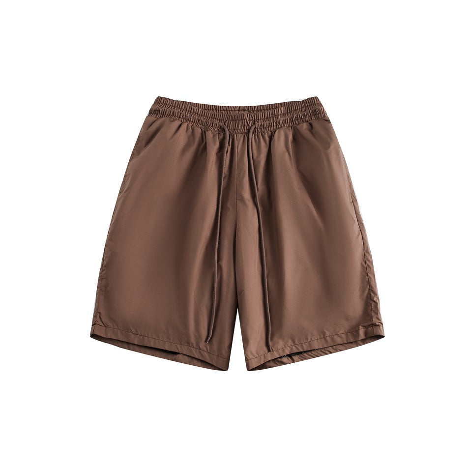 Brown knee-length shorts with an elastic drawstring waistband, flat lay front view on white background