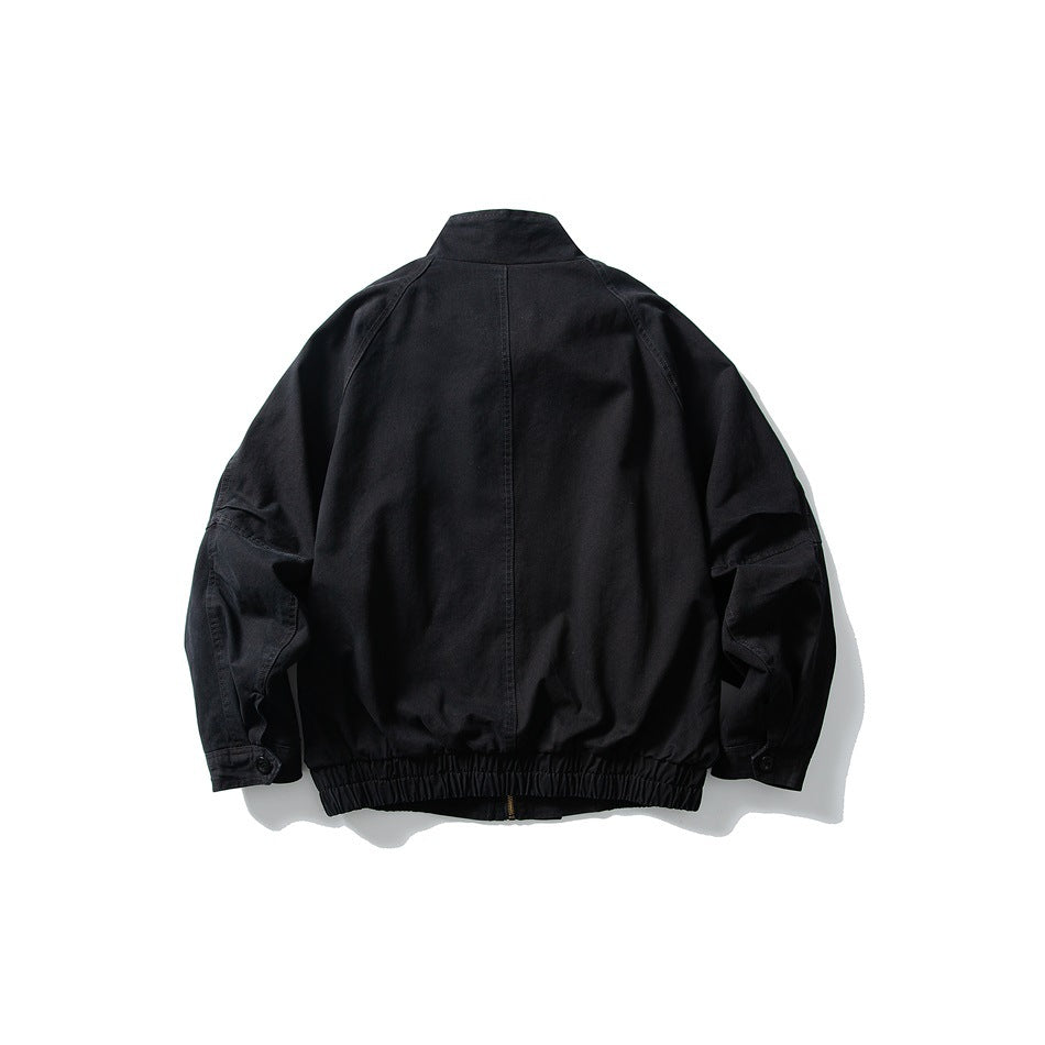 Black stand-collar jacket flat lay, back view, with raglan sleeves, center back seam and elastic hem