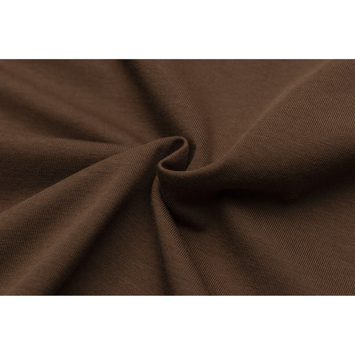 Close-up of brown fabric gathered to show its fine surface texture.