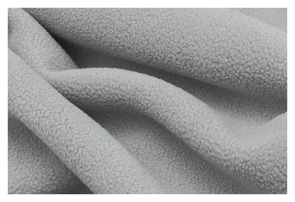 Close-up showing the soft, nubby texture of light gray fleece fabric.