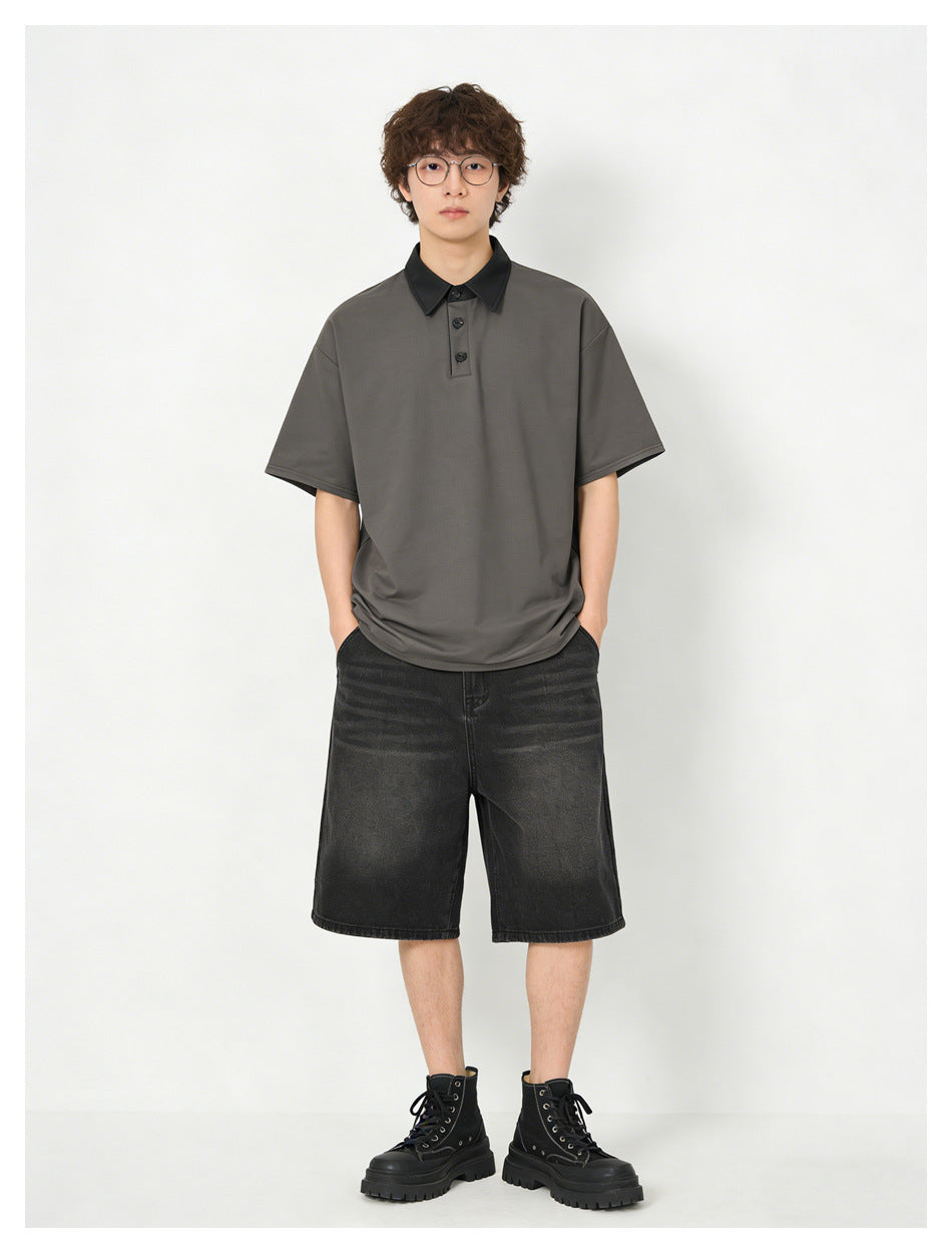 Model wearing the dark gray polo-style top with black collar, black washed denim shorts and black lace-up boots