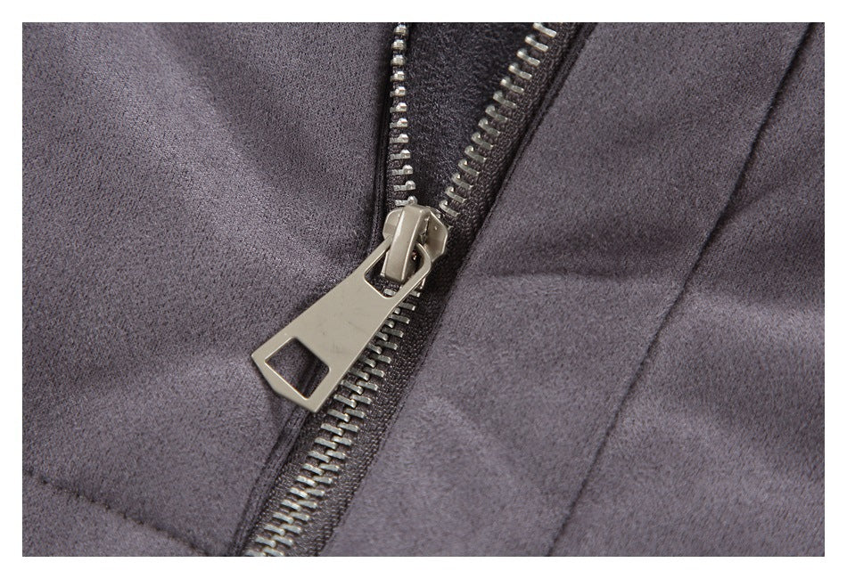 Close-up of the gray jacket's metal zipper and large silver pull.