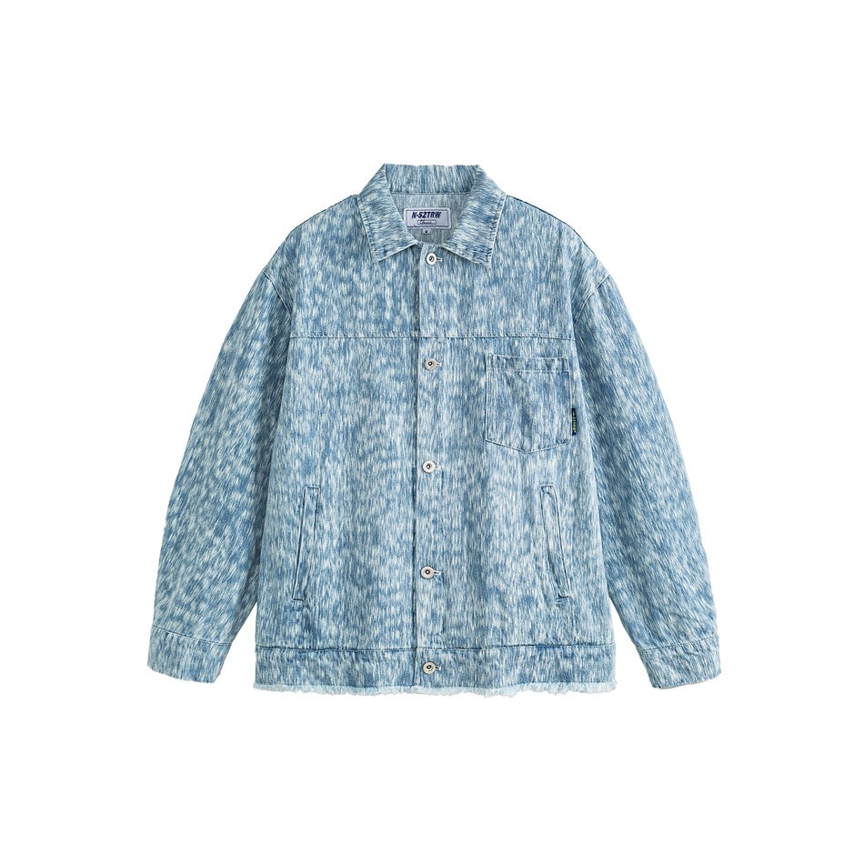 Light blue mottled washed denim jacket, front view with buttons, chest pocket and frayed hem