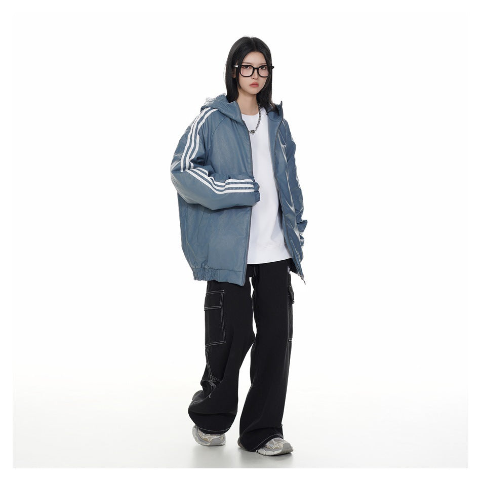 Full-length model wearing an open blue-gray hooded jacket with white sleeve stripes and black cargo pants.