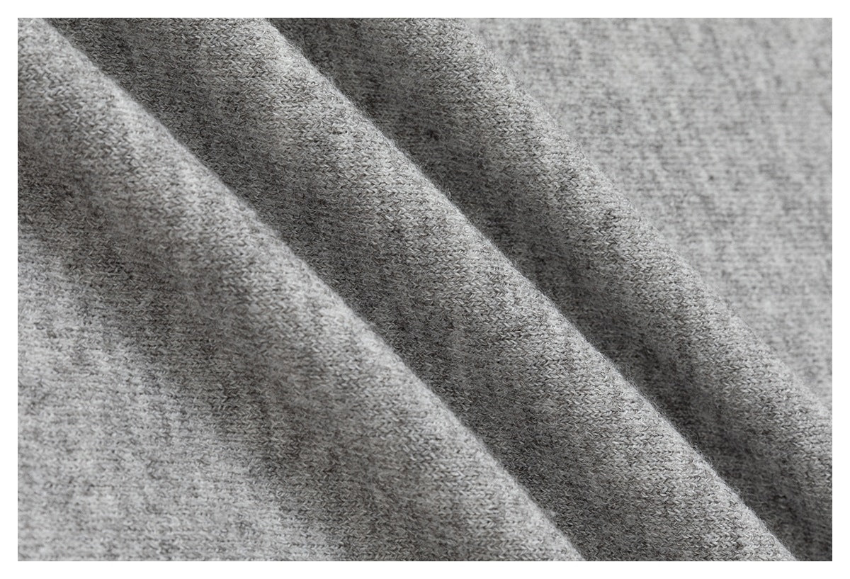 Macro view of the knit texture in heather gray fabric.
