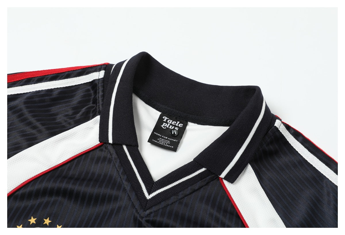 Close-up of a dark pinstriped jersey collar with white trim, red piping, and a visible neck label.