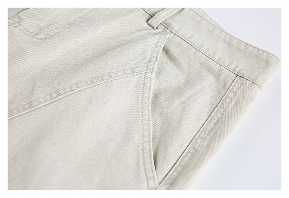 Close-up of a light beige trouser pocket and stitched seams.