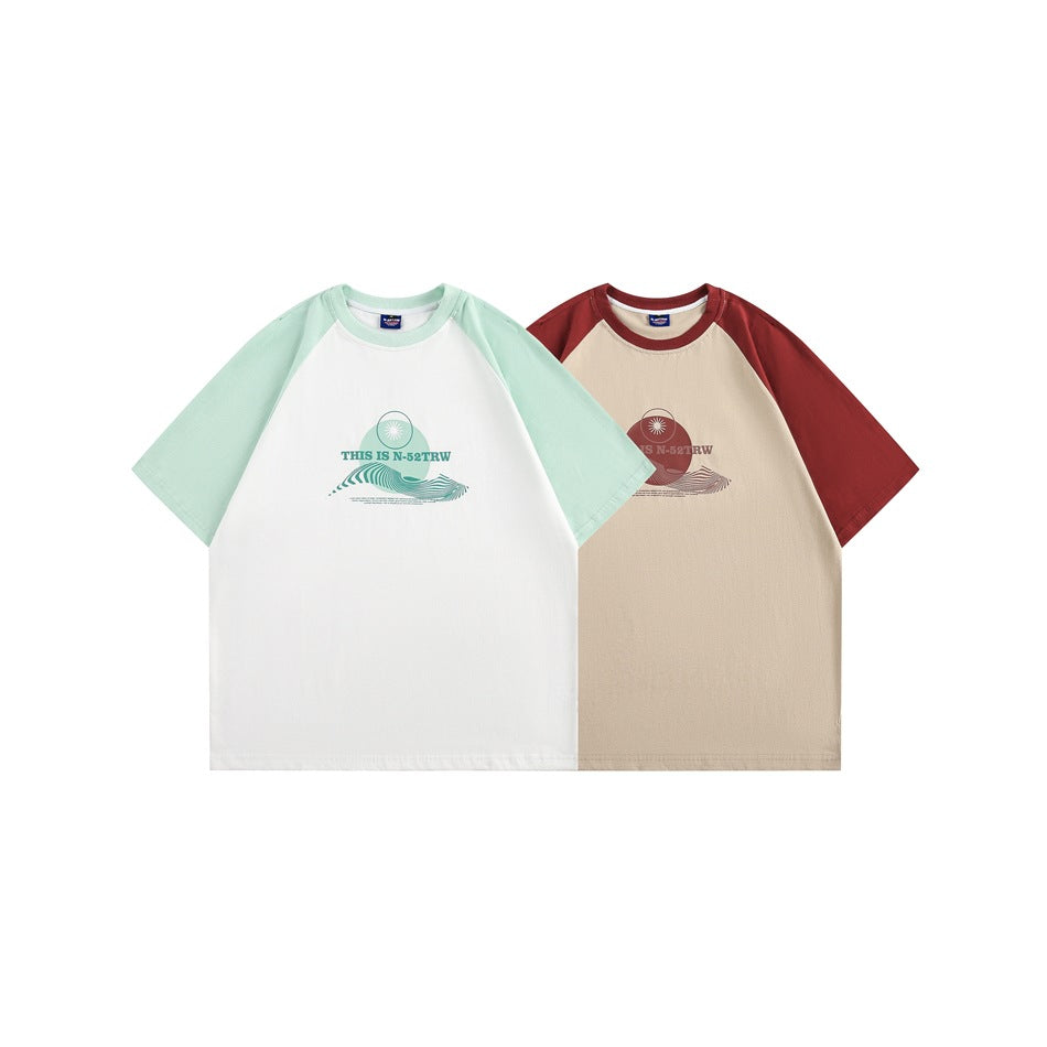 Two short-sleeve raglan T-shirts shown from the front: white with mint sleeves and beige with burgundy sleeves, both printed.