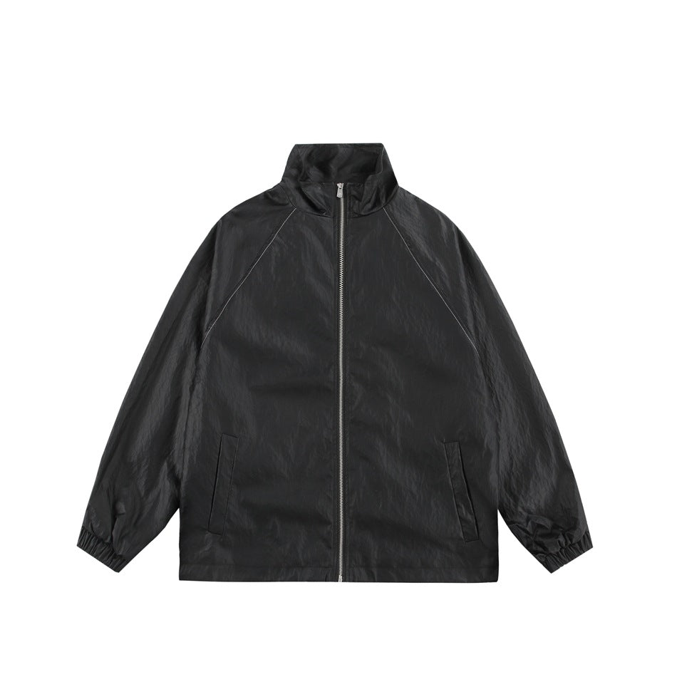 Black stand-collar zip jacket with raglan sleeves, slanted front pockets and elastic cuffs, flat front view