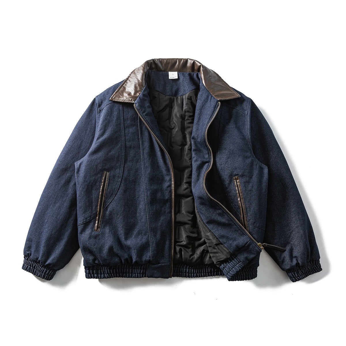Navy jacket flat lay with front zipper open showing black quilted lining and brown contrast collar
