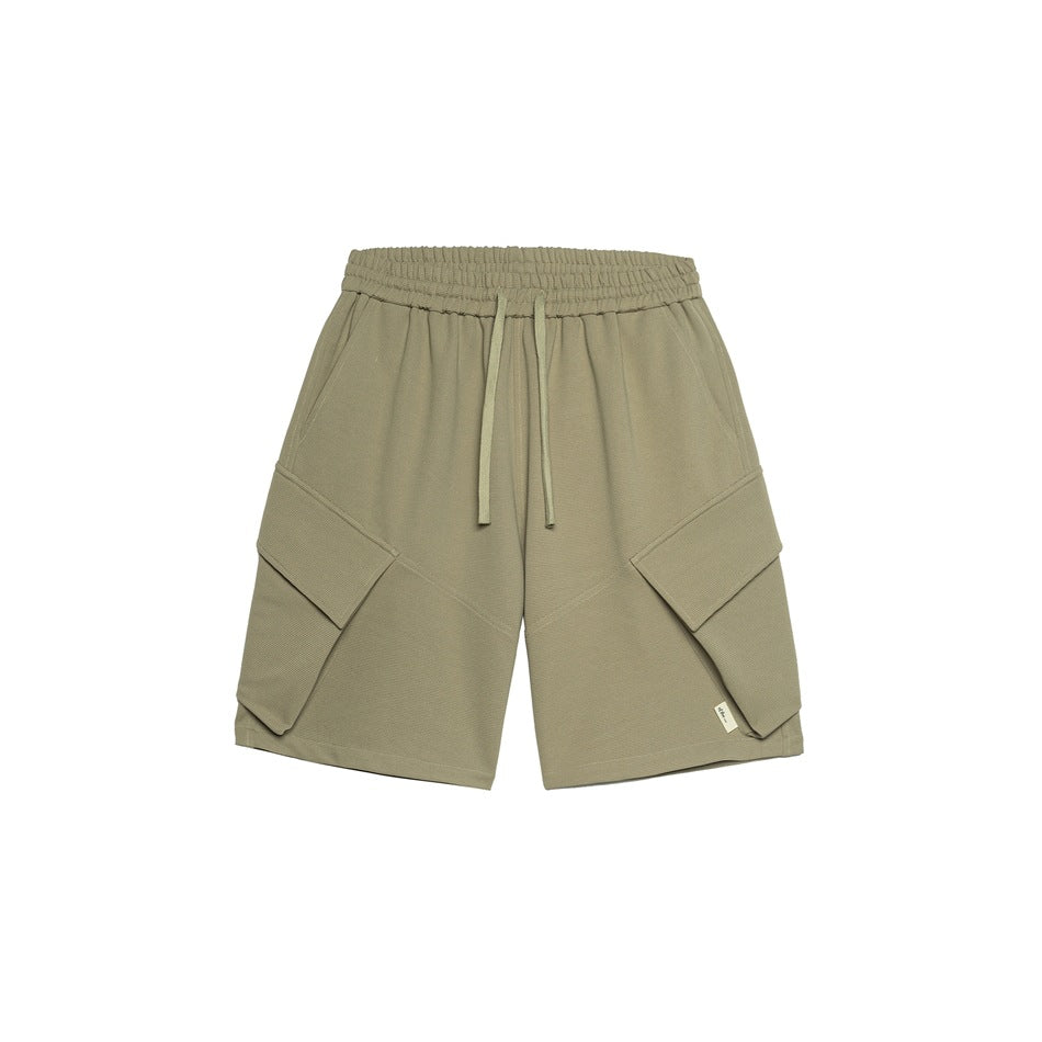 Gray-green knit cargo shorts, front view, with drawstring waistband and large flap pockets on a white background