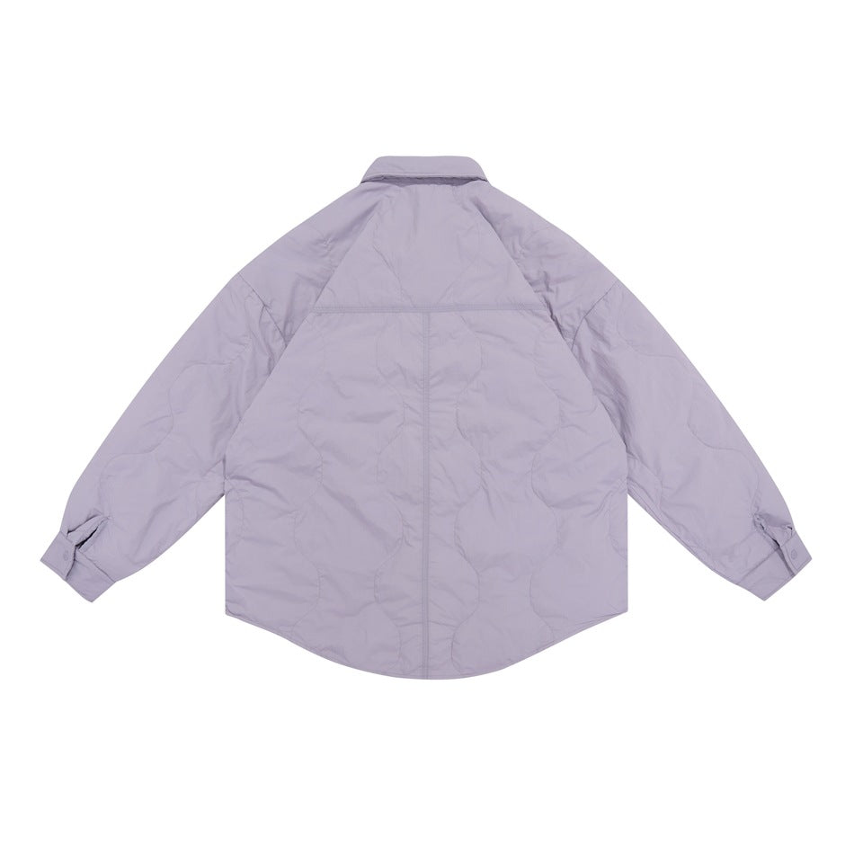 Back view of a pale lavender quilted jacket with a pointed collar, long sleeves, snap cuffs and a curved hem.